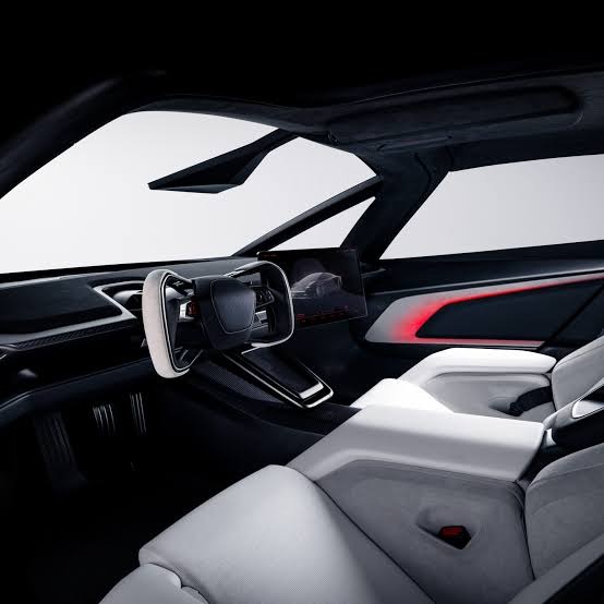 Supplied Roadster cabin reference showing white upholstery, black surfaces and red accents.