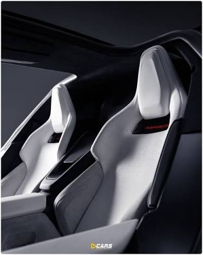 Supplied close reference of a sculpted white Roadster seat with black inset.